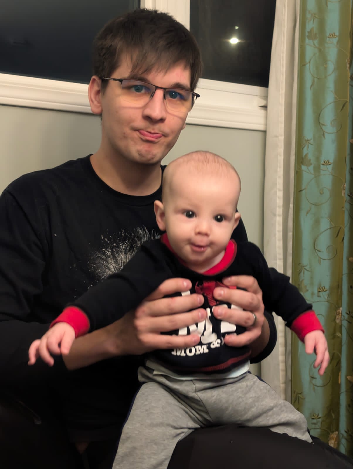 Brother Caleb holding his first born baby boy . Glory be to God Almighty